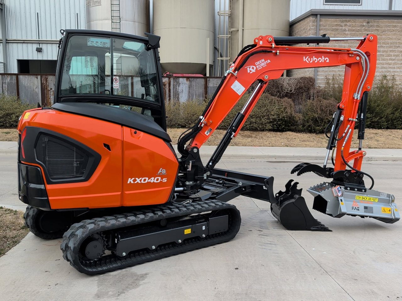 Kubota KX040-5 mini excavator with bucket, grapple and mulcher head